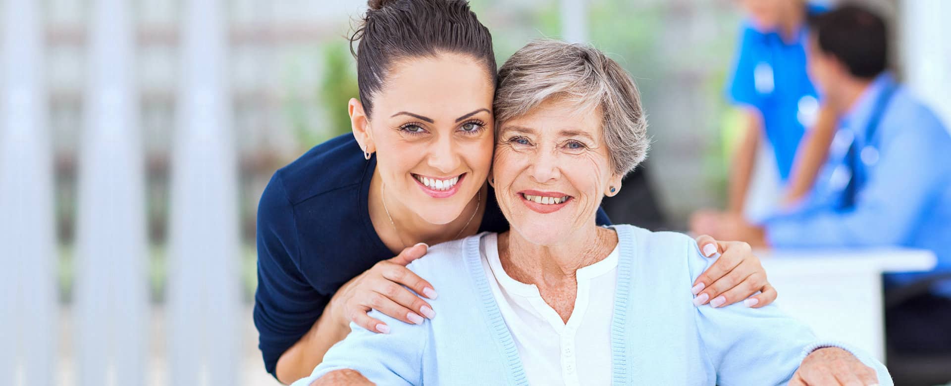 caregiver and elderly smiling