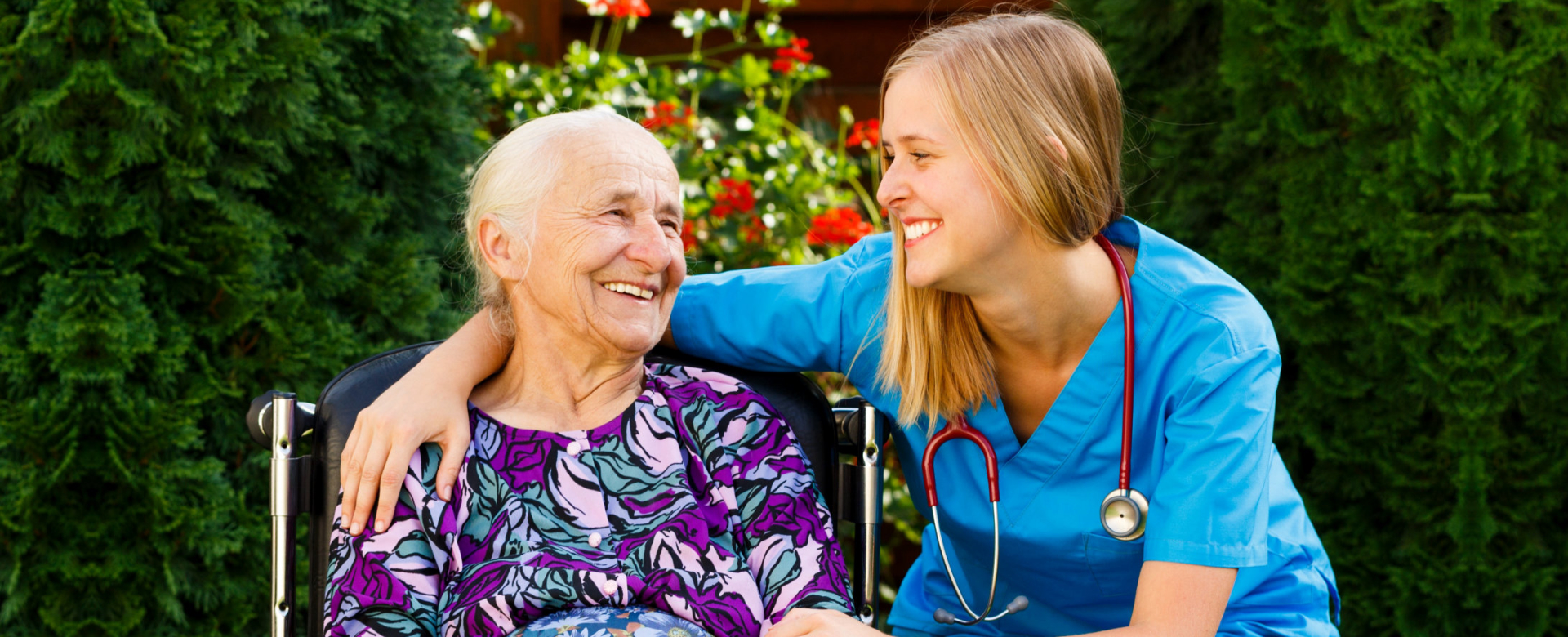 Supporting young doctor with elderly patient at the nursing home